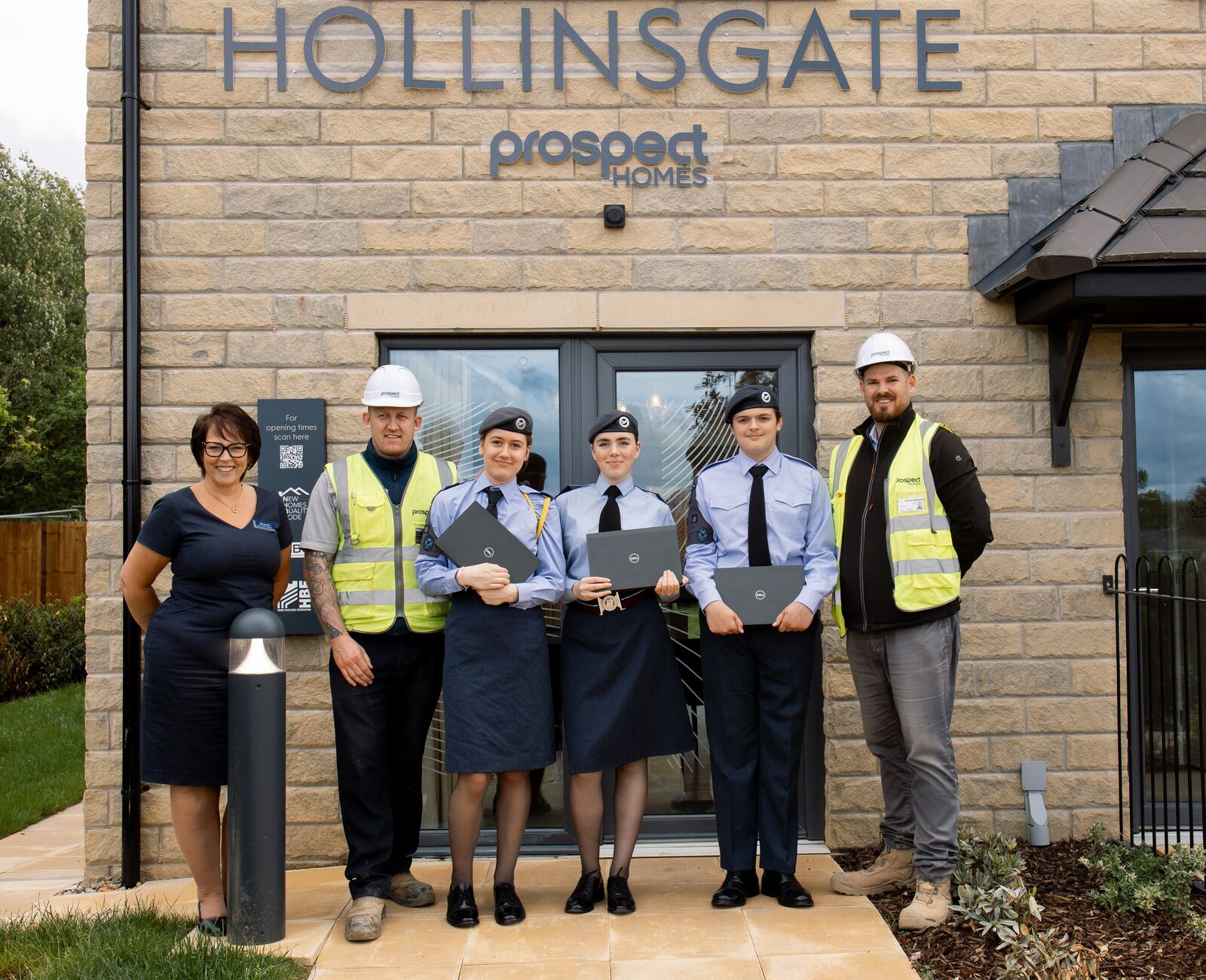 The Cadets show members of the Prospect team their new laptops